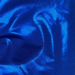 Close-up of shiny blue swimwear fabric with textured, metallic finish