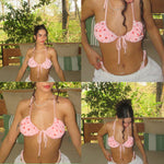 Woman wearing a handmade pink beaded bikini top outdoors on a wooden bench with green pillows