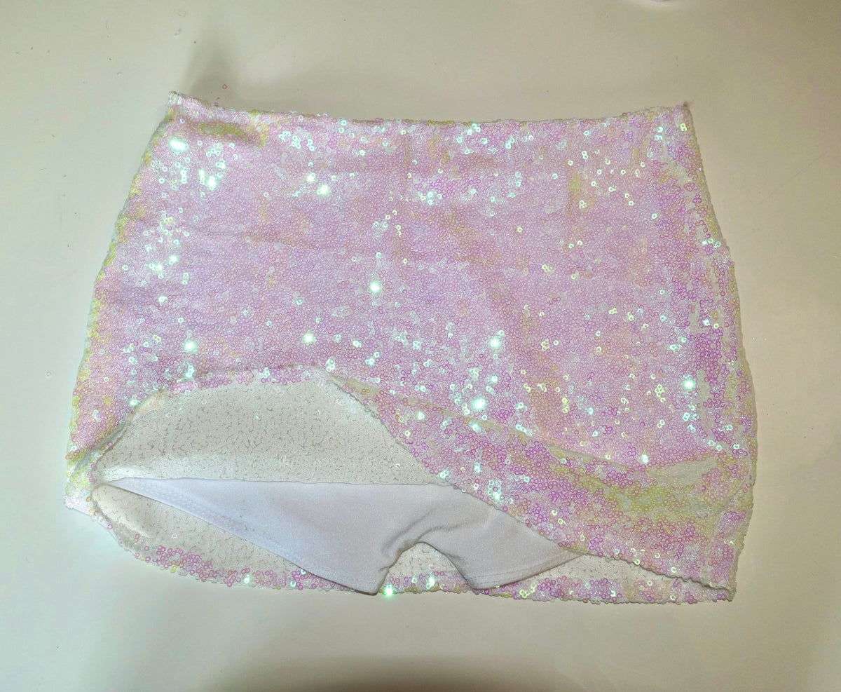 Handmade reversible sequin bikini bottom in shimmering pastel pink and white, flat lay