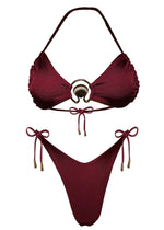 Burgundy bikini set with shell and gold ring detail, adjustable string ties, flat lay