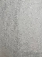 White textured fabric with subtle leaf pattern, ideal for handmade swimwear and bikinis