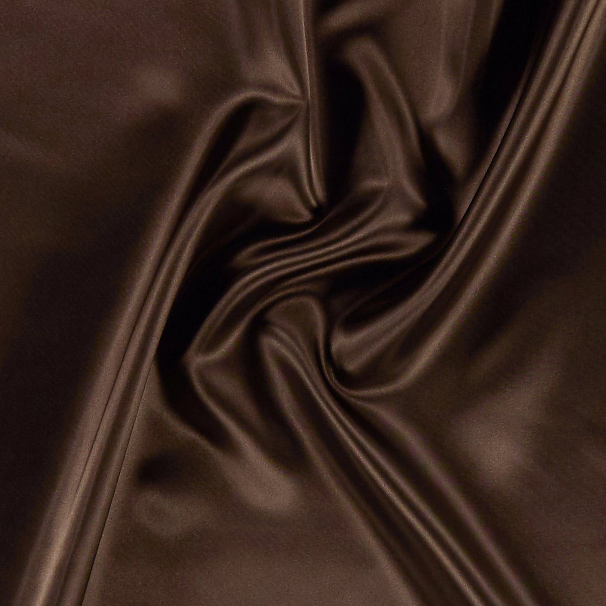 Close-up of smooth brown swimwear fabric with soft folds, ideal for handmade bikinis