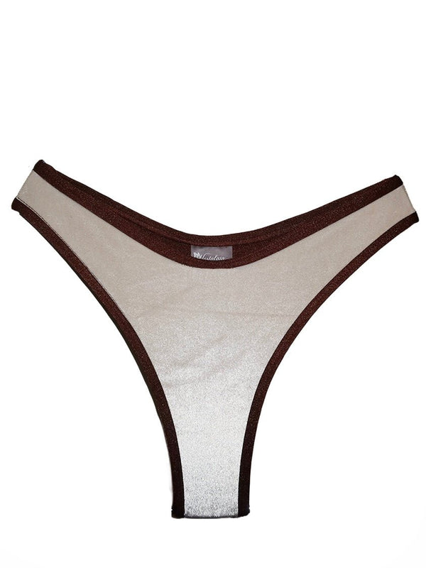 Handmade reversible bikini bottom with brown trim and shiny beige fabric, isolated on white