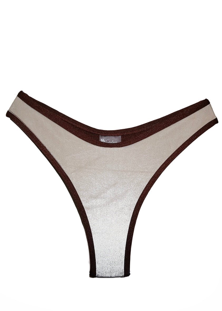 Handmade reversible bikini bottom with brown trim and shiny beige fabric, isolated on white
