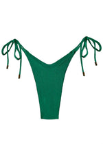 Emerald green bikini bottom with side tie strings and gold accents, swimwear flat lay