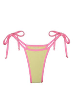 Yellow bikini bottom with pink trim and adjustable tie sides, reversible swimwear.