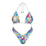 Handmade reversible bikini set with colorful floral pattern and smiling faces on white background