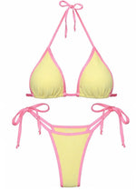 Yellow and pink reversible bikini set with tie straps and triangle top on white background