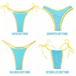 Four styles of reversible blue and yellow bikini bottoms: Capri, Sorrento, Valencia, Seychelles.