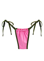 Pink and green handmade reversible bikini bottom with side ties on white background