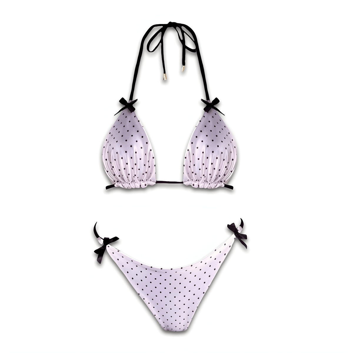 White polka dot reversible bikini set with black tie straps on white background